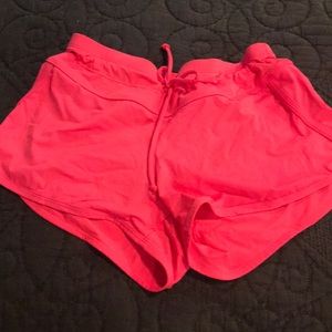 Super cute athleta swim shorts in bright orange